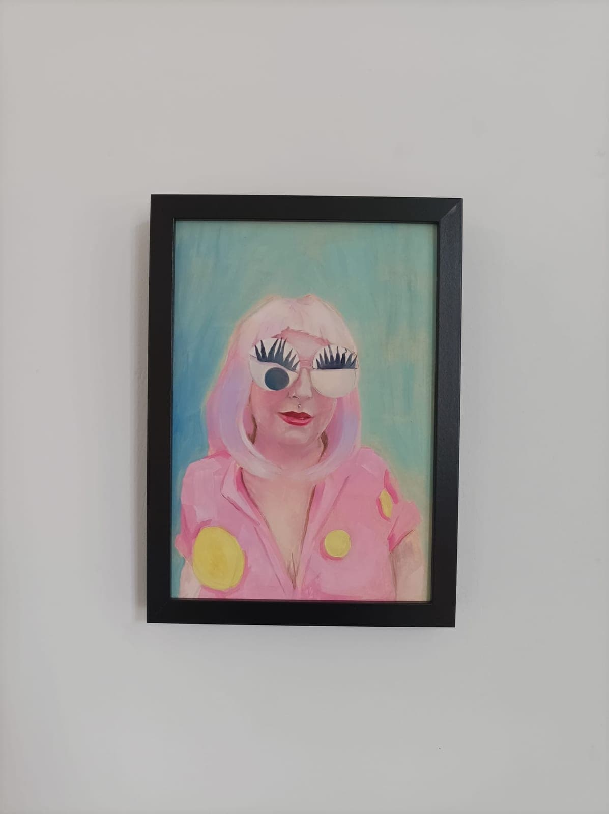 Framed, on a white wall