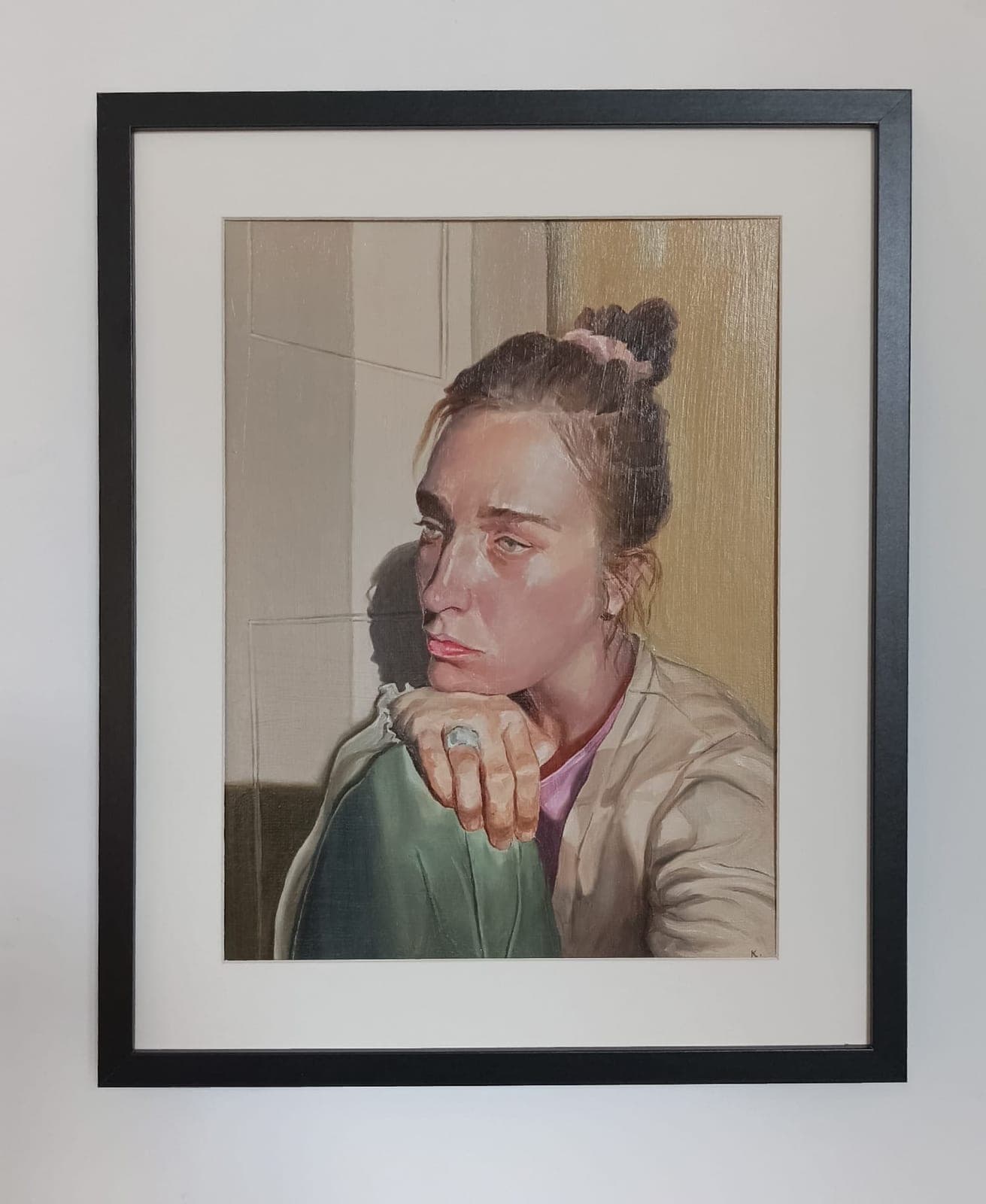 Framed, on a white wall