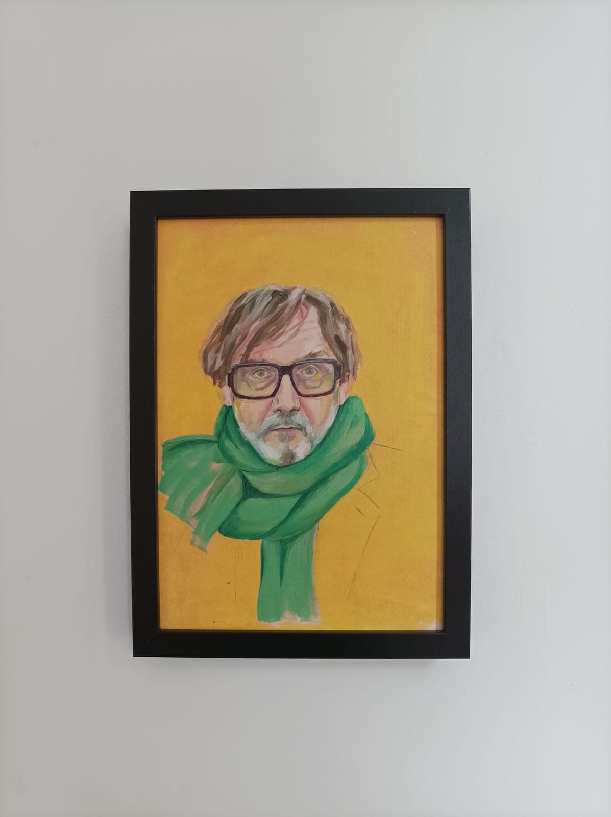 Framed, on a white wall