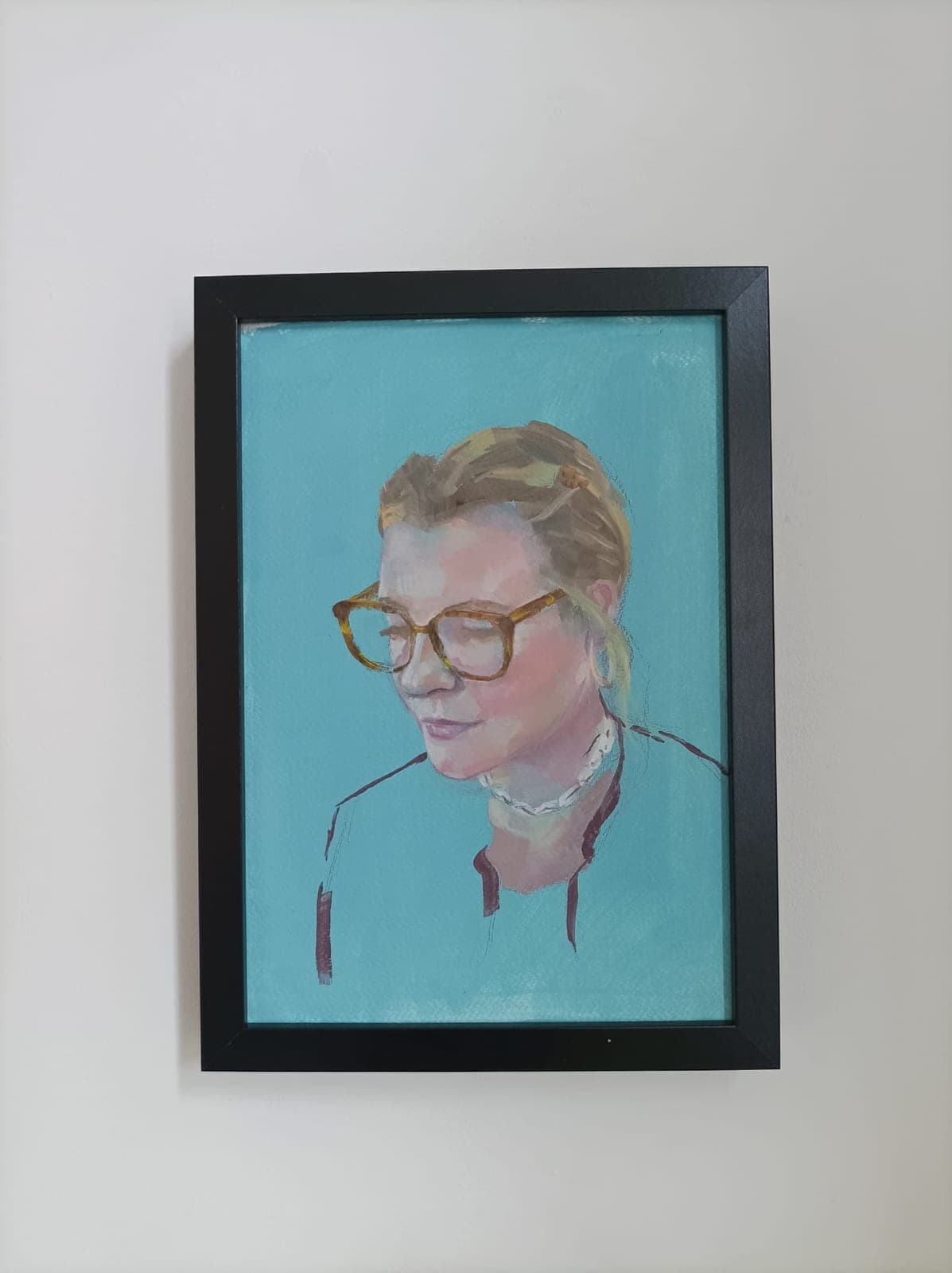 Framed, on a white wall